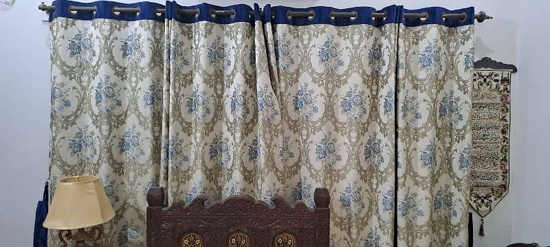 Two curtains size 90 inches length and 110 inches width wid Blue belts 1