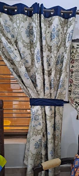 Two curtains size 90 inches length and 110 inches width wid Blue belts 4