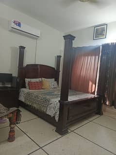 Double bed with side table