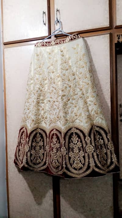 Mehroon and golden heavy embroidered lehnga with tail frock & dupatta