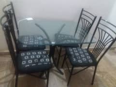 Iron dining table with four chairs