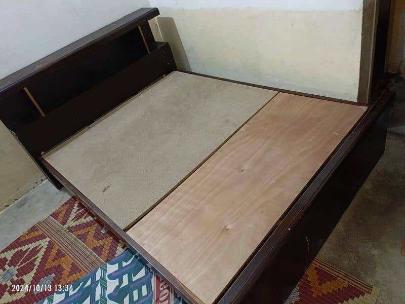 Wooden bed size 6.5 by 5 in good condition without mattress 1