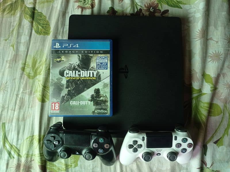 1TB PS4 Slim with 2 original controllers 2