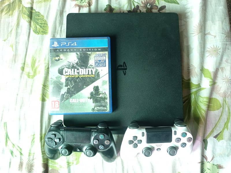 1TB PS4 Slim with 2 original controllers 3