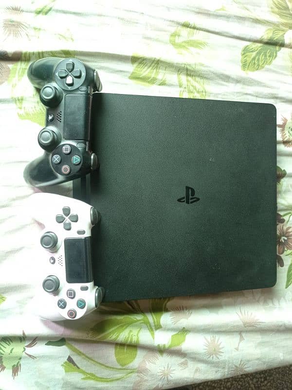 1TB PS4 Slim with 2 original controllers 4