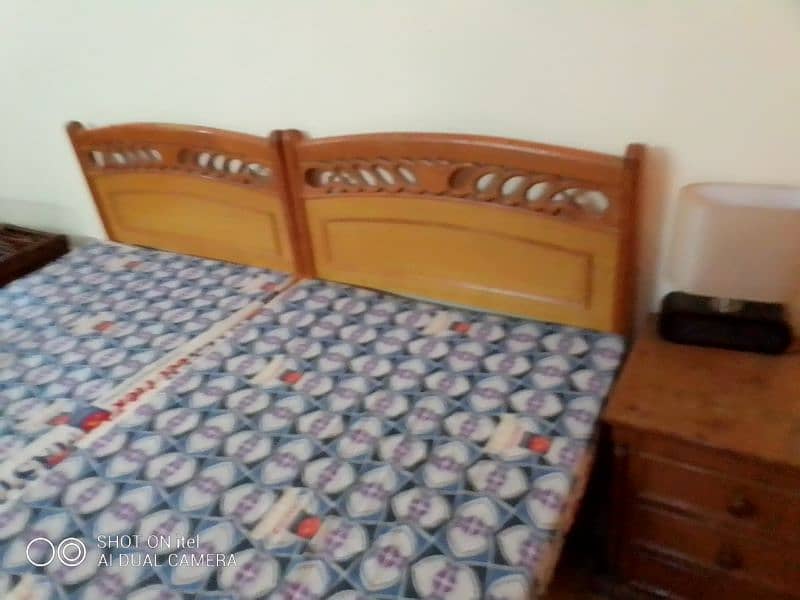 Single wooden beds and sofa set with side table 0