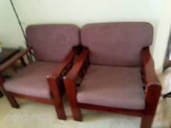 Single wooden beds and sofa set with side table