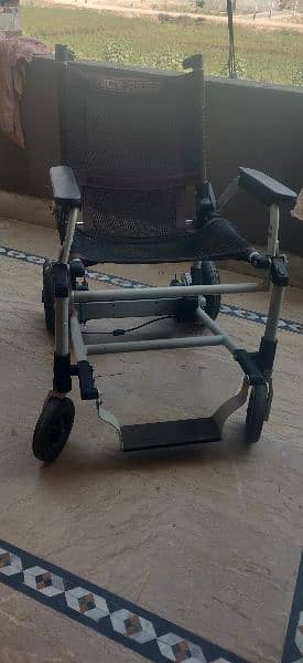 Motorized wheelchair imported foldable. 2 pieces 1