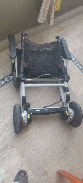 Motorized wheelchair imported foldable. 2 pieces 5