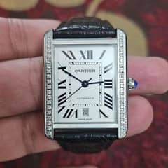 Cartier tank with after market diamond