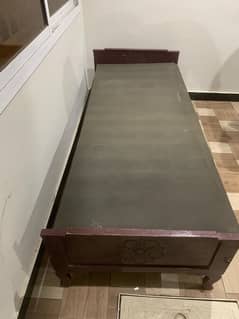 wood bed with clean mattress