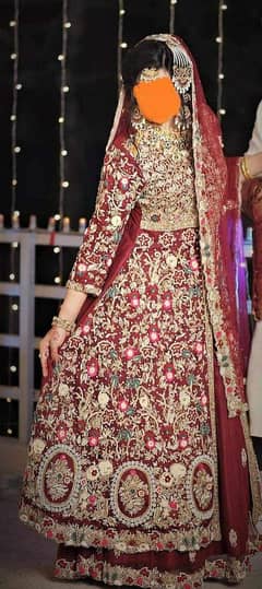 A very heavy embroidered and embellished long shirt bridal lahenga