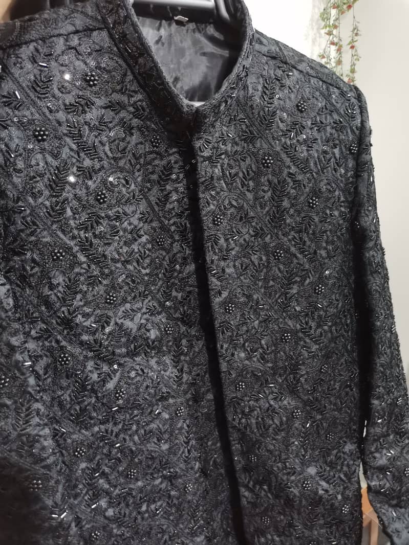 Black Sherwani with mehroom kulla only 1 time used. 2