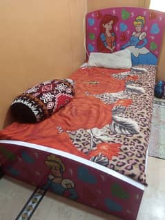 single bed with wordrobe