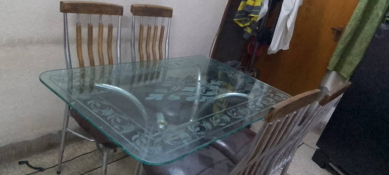 Dining table with 4 chairs. 1