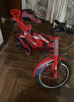 kids bicycle in 16 inches brand new condition ted in colour