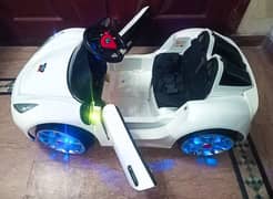 Kids ferrari car,with swing mode,Dual batteries,lights in wheels,music