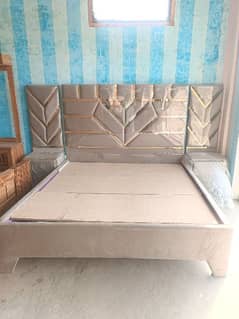 poshish bed with site tables and dressing