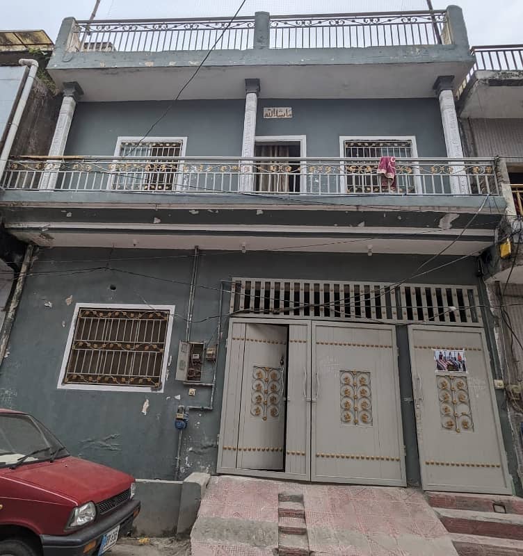 "5 Marla Double-Storey House for Sale near Dubai Plaza, 6th Road. Currently Rented at PKR 60,000/month. " 2