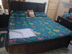 bed set along with dressing table and cupboard