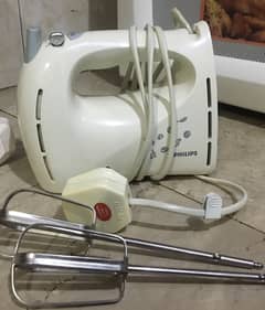 Hand mixer and orange juice citrus