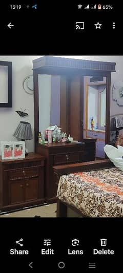 A wooden long sided mirror with storage