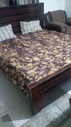 A wooden bed for sale