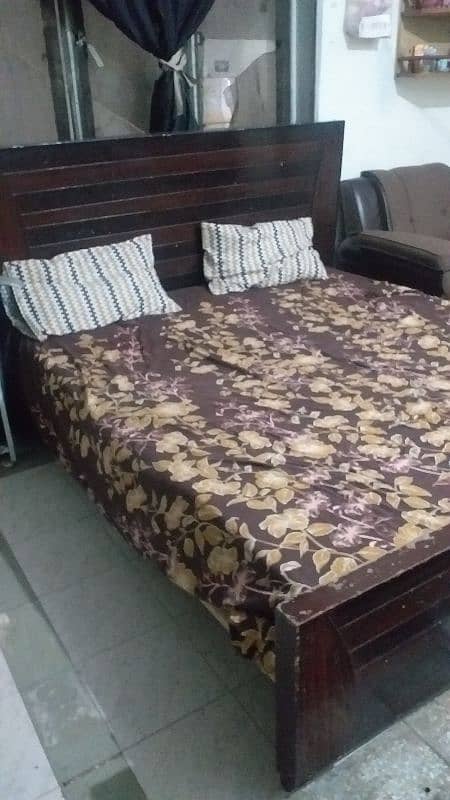 A wooden bed for sale 1