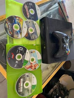 Xbox 360 gaming with box and Xbox cds gta5