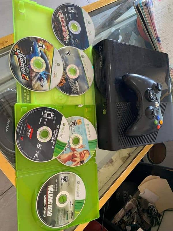 Xbox 360 gaming with box and Xbox cds gta5 0