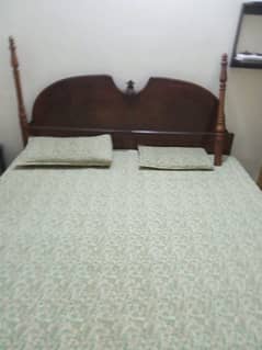 used double bed with side table and matters