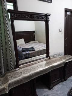 Solid wooden bed with dressing table and side tables