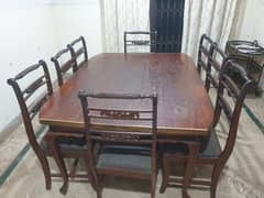 Wooden dinning table with 8 chairs