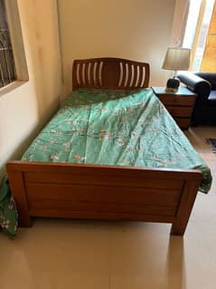 single bed with side table