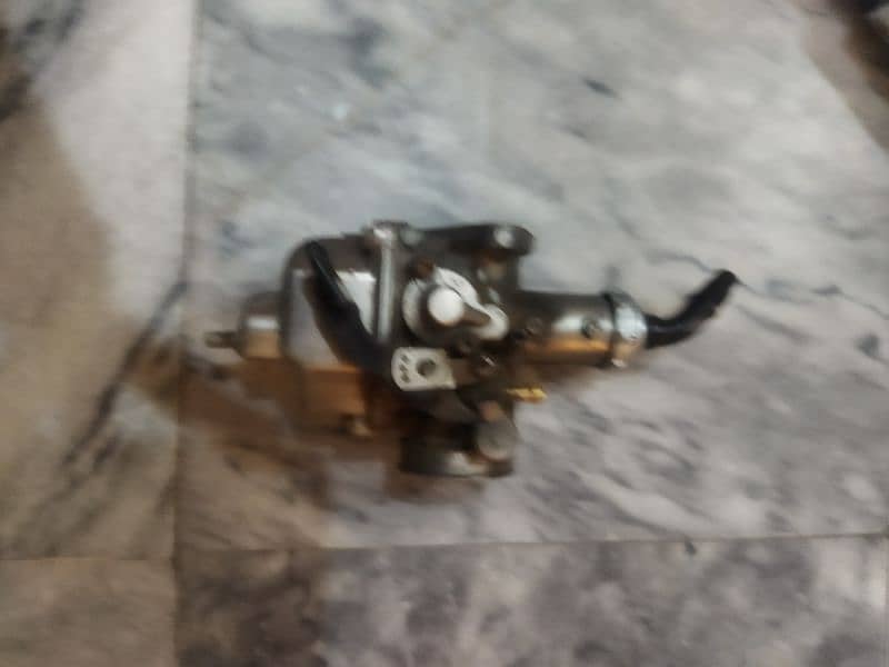 125carburetor original and sock 2