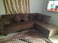 L shaped sofa with cushions