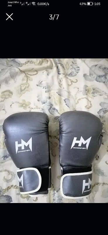 leather boxing bag with boxing gloves. 2