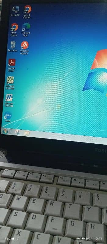 Toshiba laptop with charger. 1