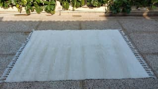 Cream coloured rug 6.5x4.5 feet