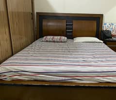 king size bed with 2 side tables and dressing