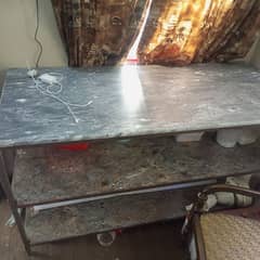 Iron shelves with marble top