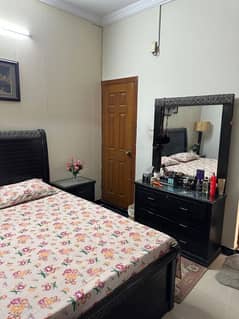 Double Bed alongwith side tables and dressing table.