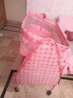 Pink Baby Cot with storage section