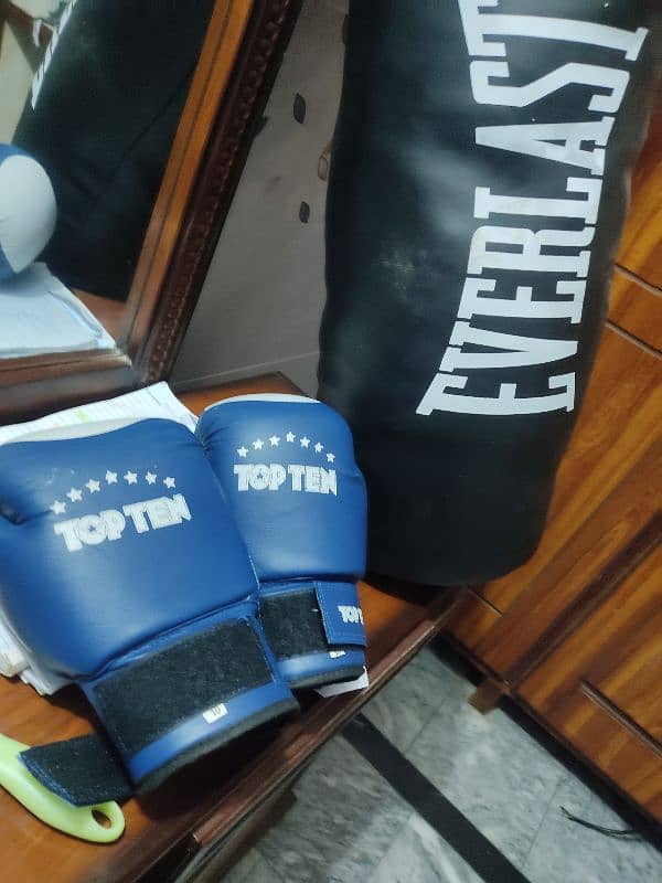 punching bag and gloves for sale almost like new good quality  4feet 2