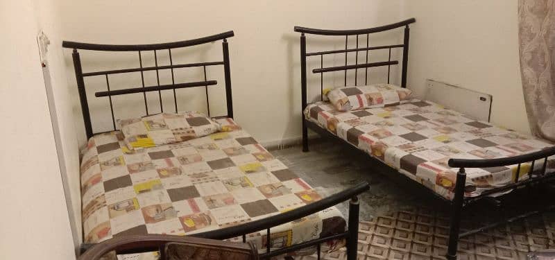 2 single beds with mattresses 1