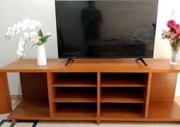 7 ft long TV console with 3 side shelves.