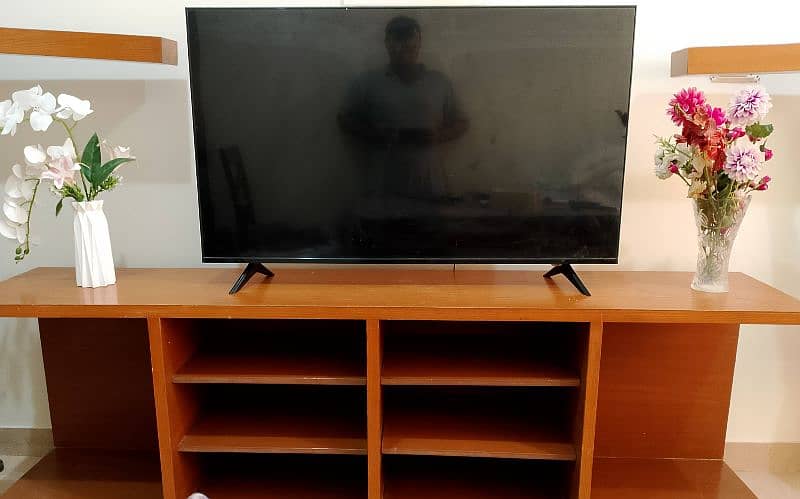 7 ft long TV console with 3 side shelves. 1