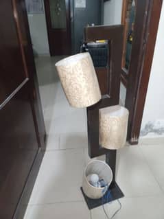 wooden lamp with 3 cream colored shades