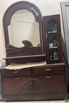 wooden bed with dressing table