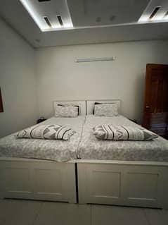 White Beds and Side Tables for Sale